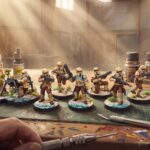 Illustration du tuto peindre les Shoretroopers Star Wars Legion, l'escouade peinte sur l'établi entre pots de peinture et pinceaux